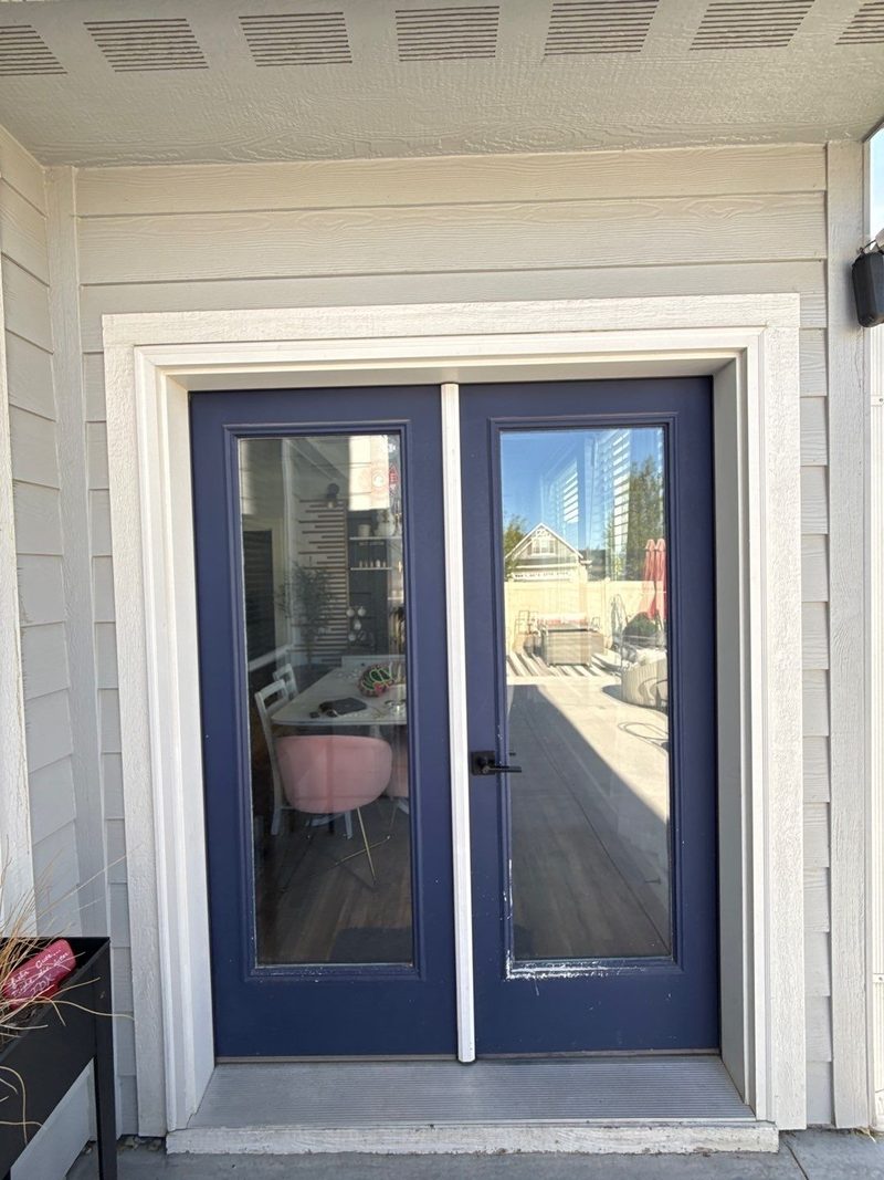 New navy French patio doors set in white trim